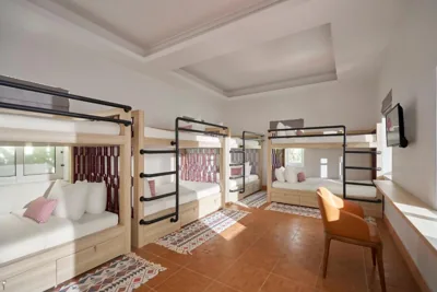 Bed in 8-Bed Dormitory Room — The Postcard Hotel